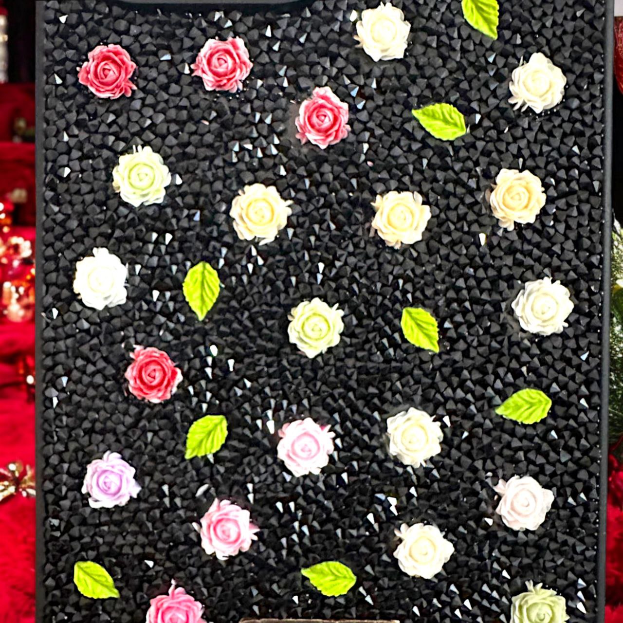 Luxury flower patterned iPhone cover, iphone 15 pro cover adorned with colorful mini roses and glittering black rhinestones for a sophisticated look.