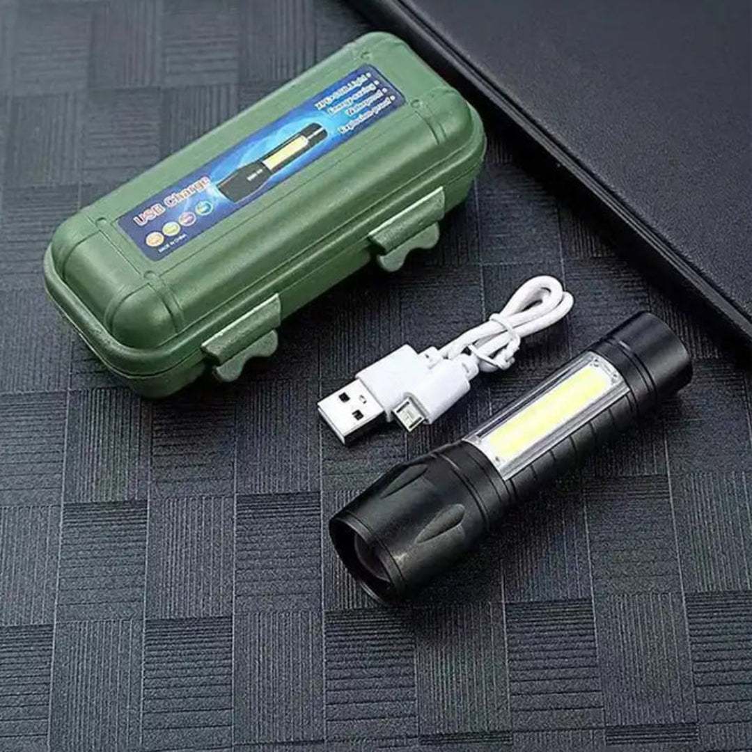 Rechargeable LED flashlight with USB cable and green carrying case displayed on a black textured surface