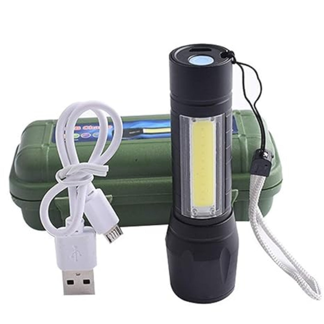 Flashlight standing upright with USB cable and green case, designed for travel and emergency use.