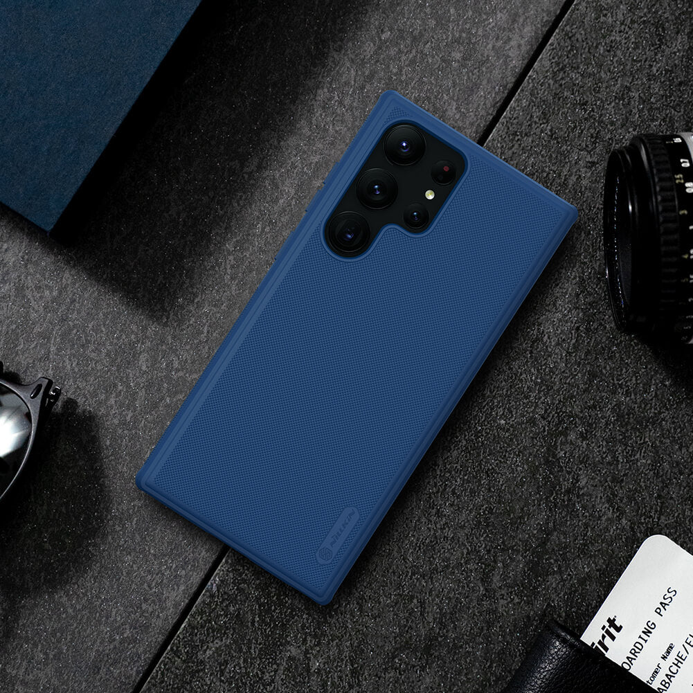 Navy blue Nillkin case on a phone resting on a textured surface, emphasizing its premium matte texture for s23 ultra cover