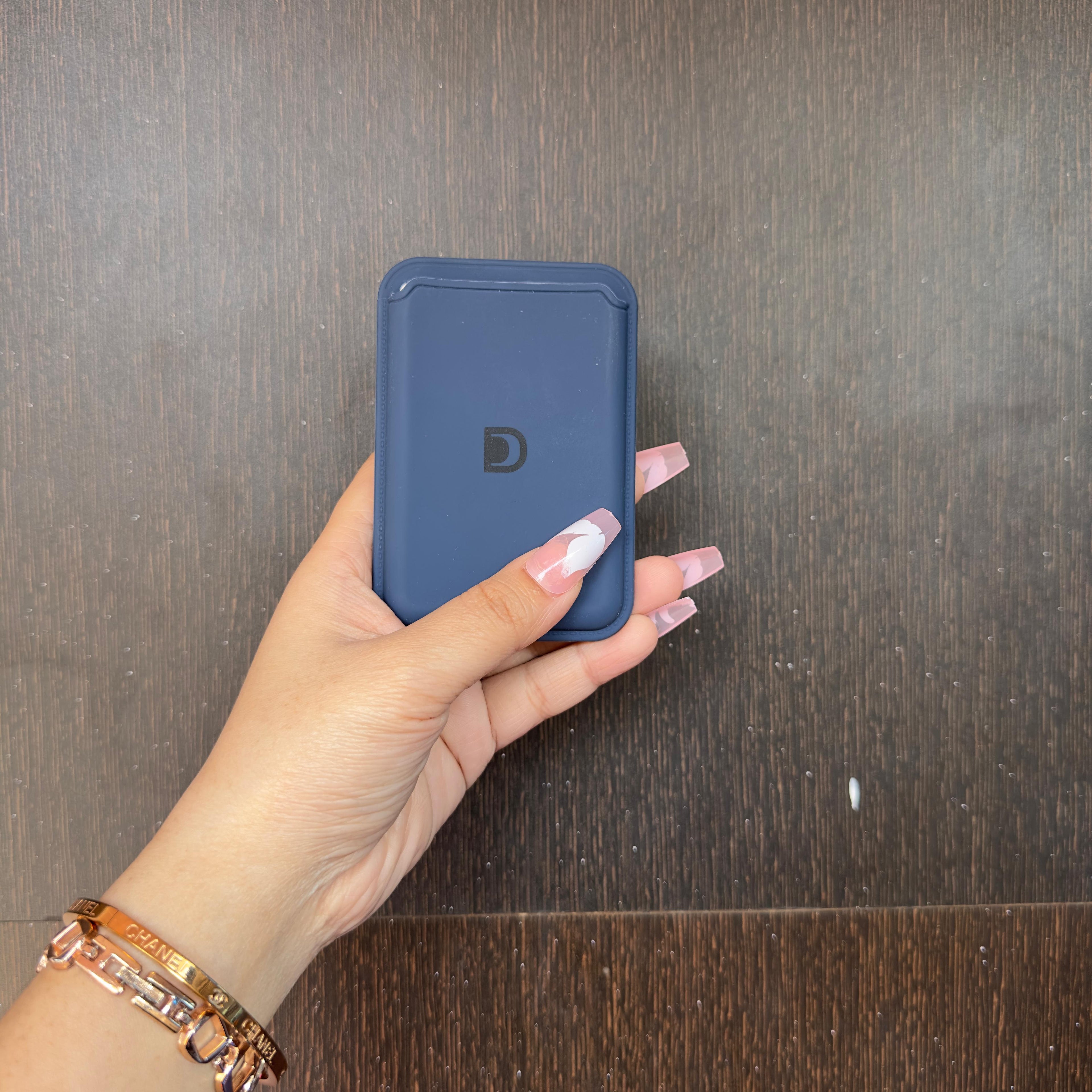 Magnetic blue leather wallet attachment held separately, iphone 16 pro case showcasing its compact and slim design