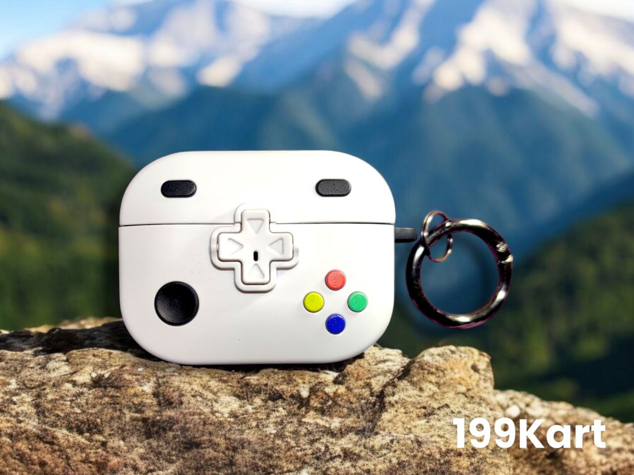 Game controller style airpod pro case with white finish and ring holder displayed outdoors on a rock