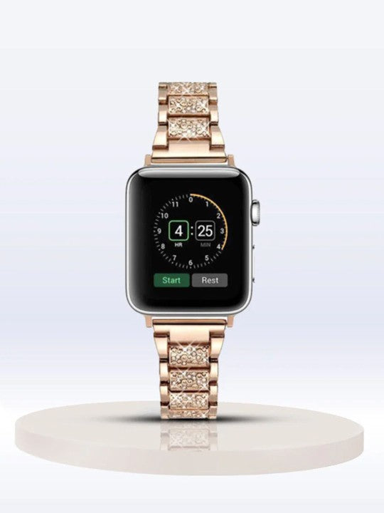 Stylish stone studded rose gold apple watch straps attached to Apple Watch, displayed vertically on a podium.