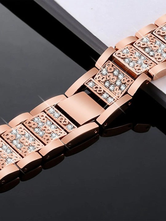 Close up of the rose gold apple watch straps showcasing embedded decorative stones and smooth link joints