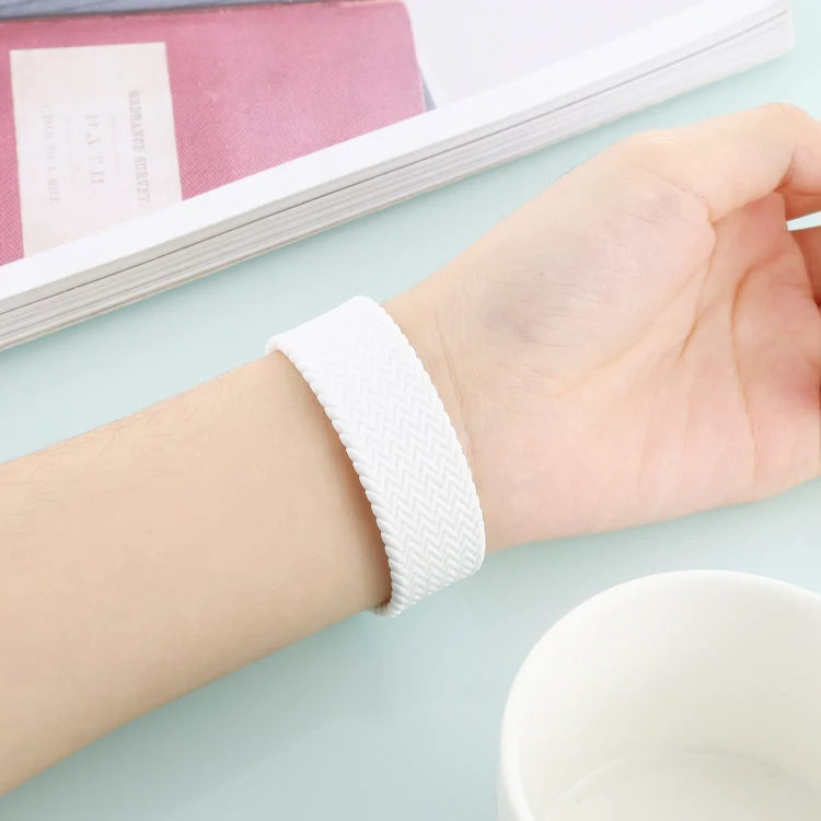 white braided loop strap worn on wrist, apple watch straps offering comfort and secure fit for Apple Watch users.