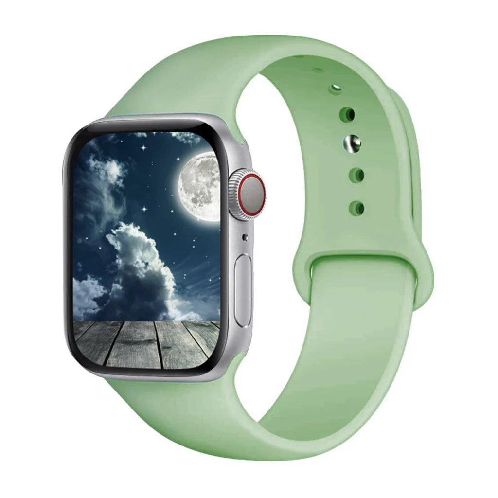 apple watch straps with a pastel green silicone strap, paired with a night sky watch face for an elegant look.