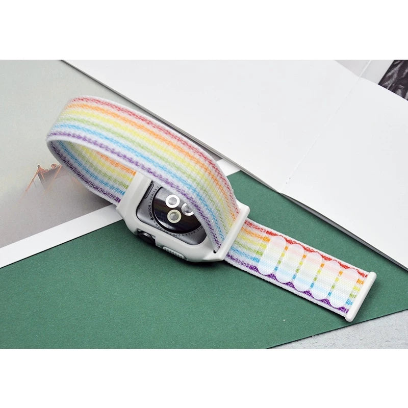 Rear view of vibrant rainbow colored Apple Watch straps arranged in a fan shape, showcasing their bright hues and textures