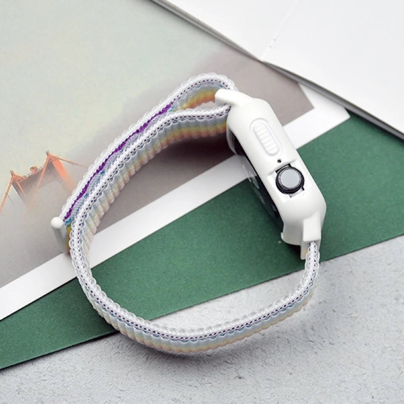 A side view of colorful Apple Watch straps in rainbow hues, arranged to highlight their bright and cheerful design
