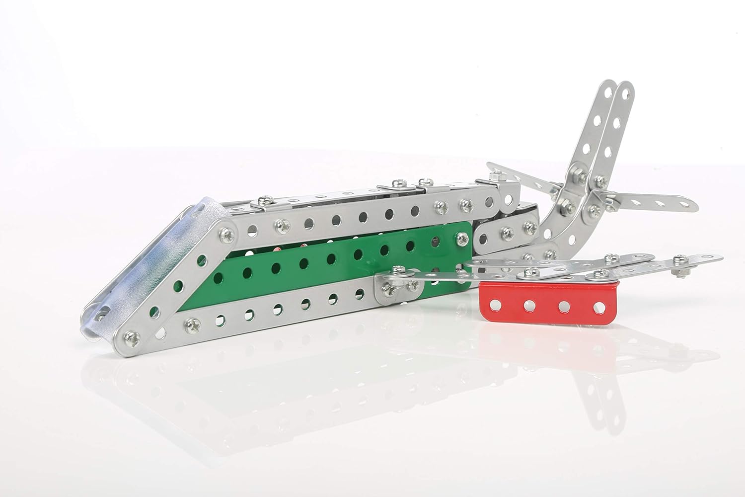 A colorful model airplane with a striking red and green wing, highlighting its playful and eye catching appearance.