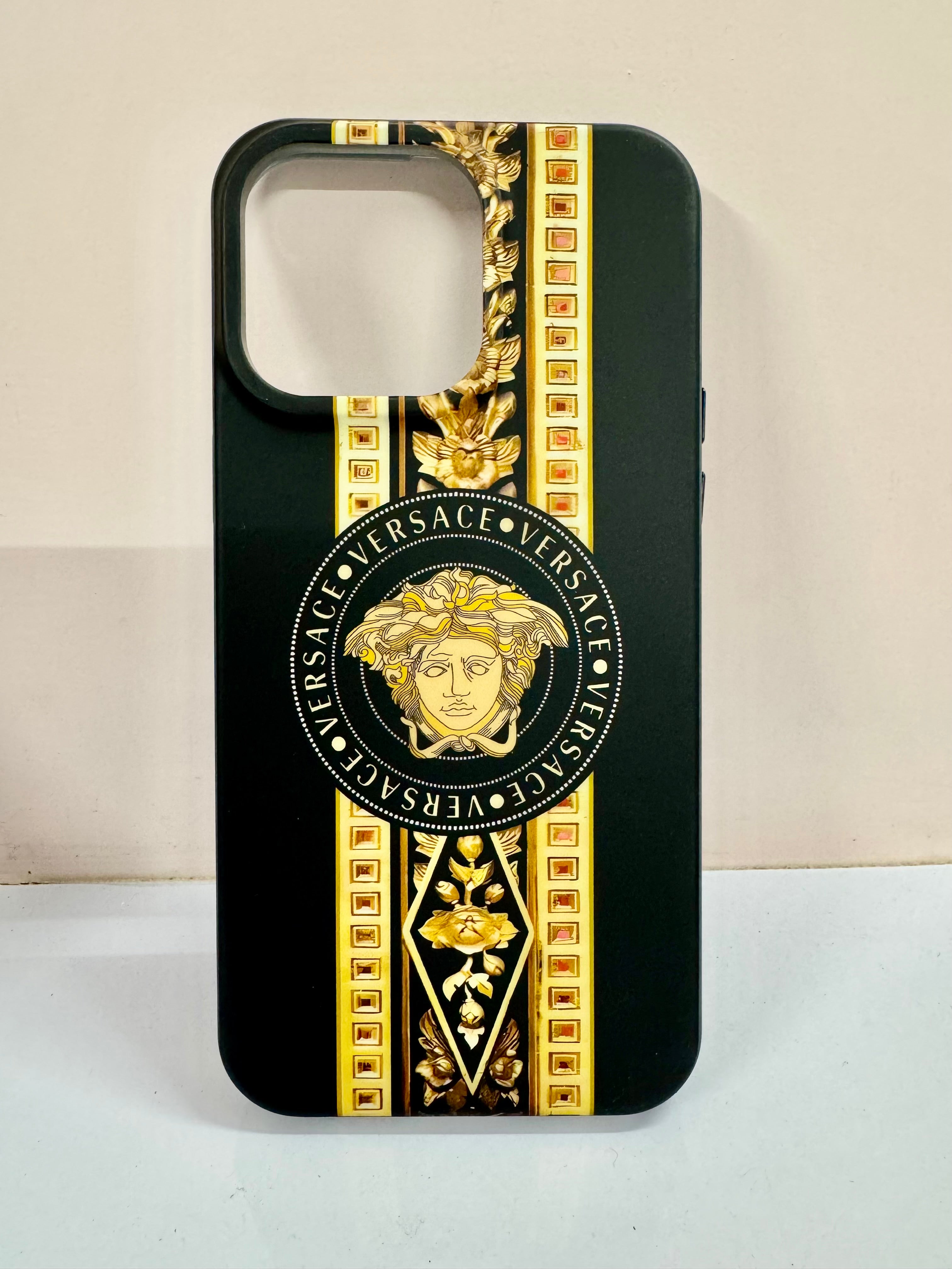 A premium black iPhone case with an elegant gold Medusa and chain print, iphone 15 pro max cover inspired by the iconic Versace luxury style