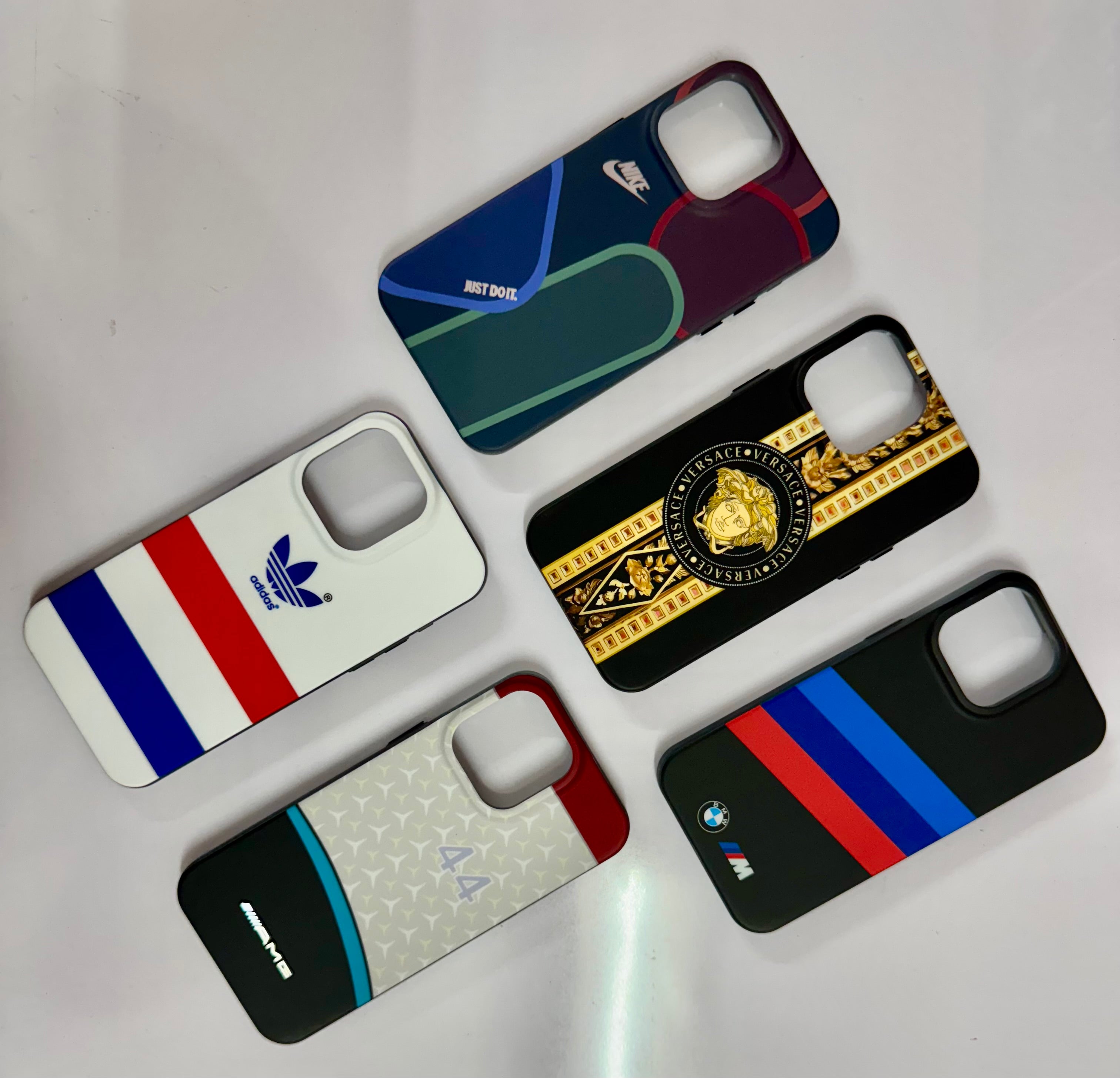 A collection of five premium iPhone covers with various sports and designer inspired prints, iphone 15 pro max cover offering both protection and unique aesthetics.