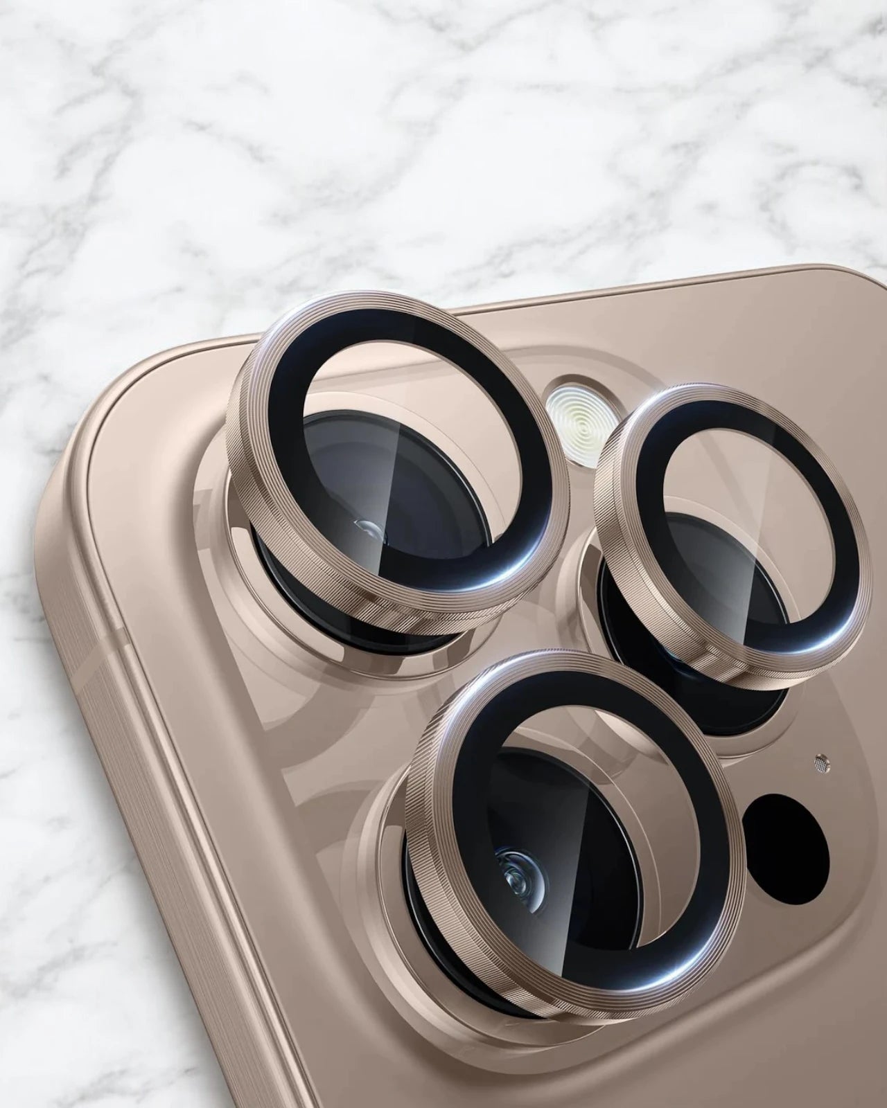 A high quality desert titanium iphone camera lens designed to safeguard the lenses of iPhone 16 Pro and Pro Max from scratches and dust.