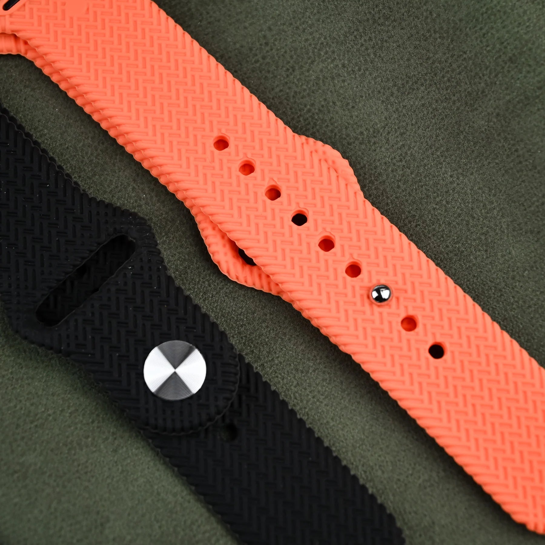 A stylish Apple Watch featuring a black and orange band perfect for tech enthusiasts.