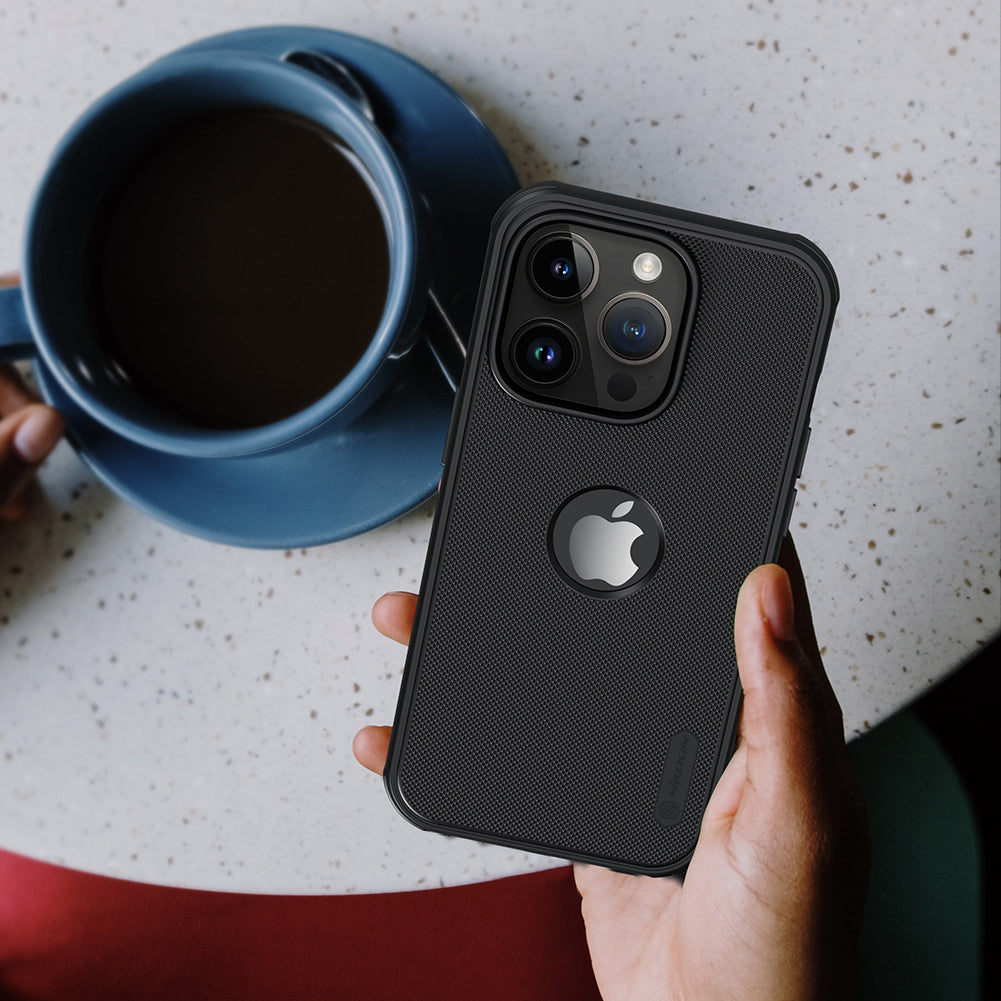  Black iPhone cover for iphone 14 plus cover held in hand beside a cup, showcasing a slim, elegant Apple cover with camera protection
