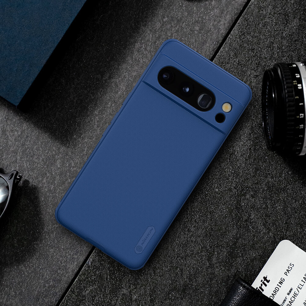 Blue Google Pixel 8 Pro case placed on a stylish desk setup, highlighting its smooth and minimalistic design
