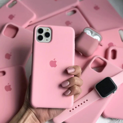 A close up of a hand holding a pink iPhone cases with a matching pink AirPods case and Apple Watch band in the background, iphone 16 cover  showcasing the stylish Apple mobile covers in silicone finish