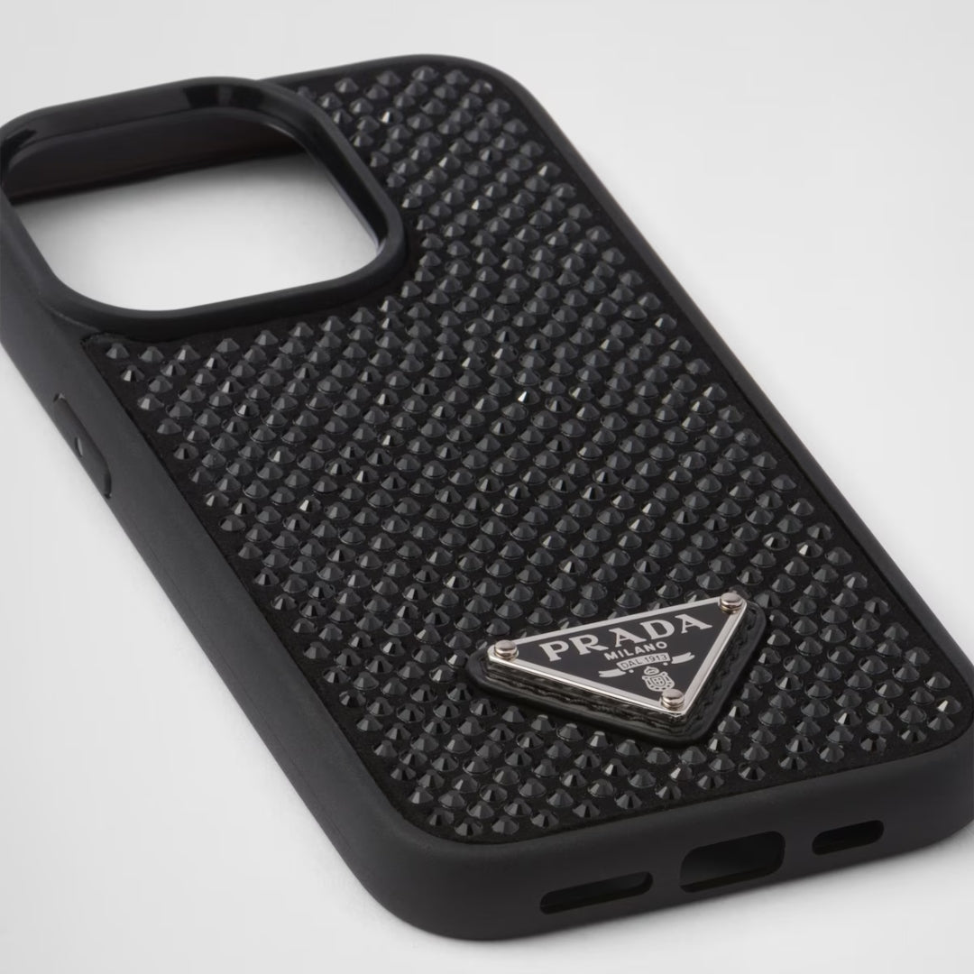 Side angle of a premium iPhone cover featuring a glitter stone back and Prada logo in a triangular metal badge for 