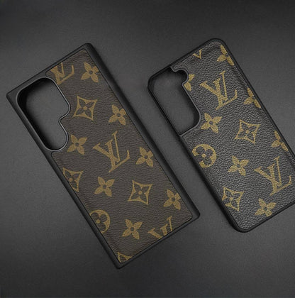 Brown leather Samsung cover with gold LV monogram print, giving the S25 Ultra a premium designer finish.