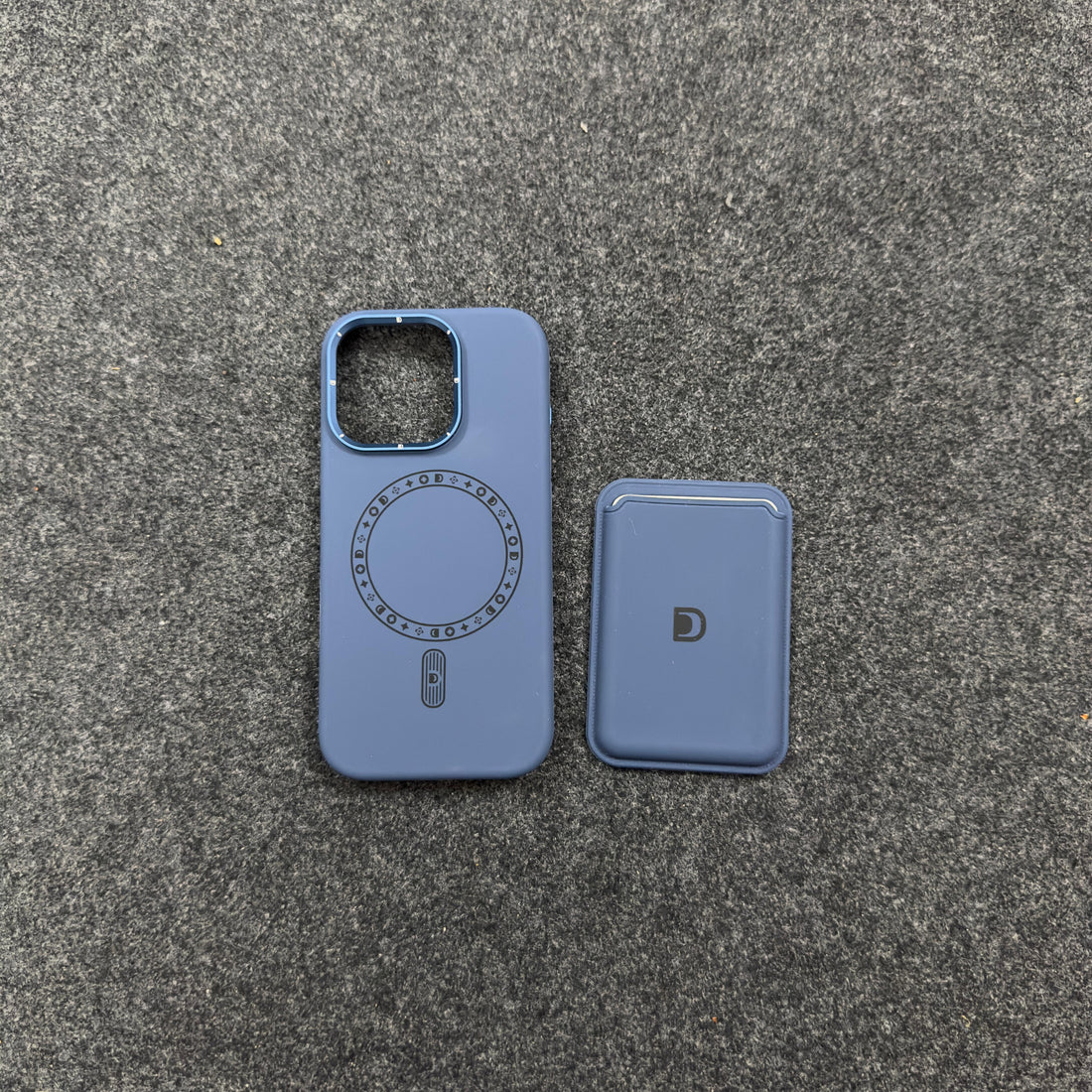 Rear view of iphone 16 pro case blue MagSafe compatible iPhone cover and wallet laid side by side on a fabric surface