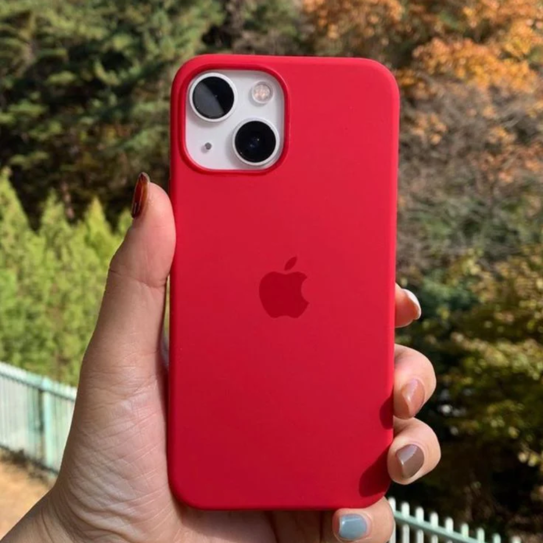 Bright red silicone iPhone case held outdoors, iphone 15 pro max cover highlighting its stylish look and snug fit on the camera lens