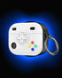 Game controller style airpod pro case with white finish and ring holder displayed outdoors on a rock