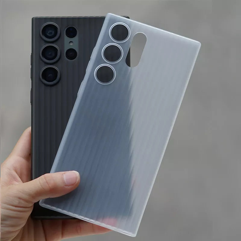 Pair of translucent mobile covers for  S25 Ultra in matte black and smoky grey, designed with vertical grooves for grip.