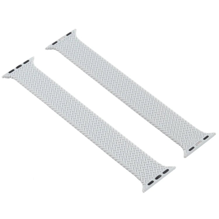 Two piece grey woven Apple Watch straps laid out flat, showing braided design and connectors.

