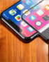 Clear tempered glass for iPhone 13, designed to prevent scratches and enhance touch sensitivity.