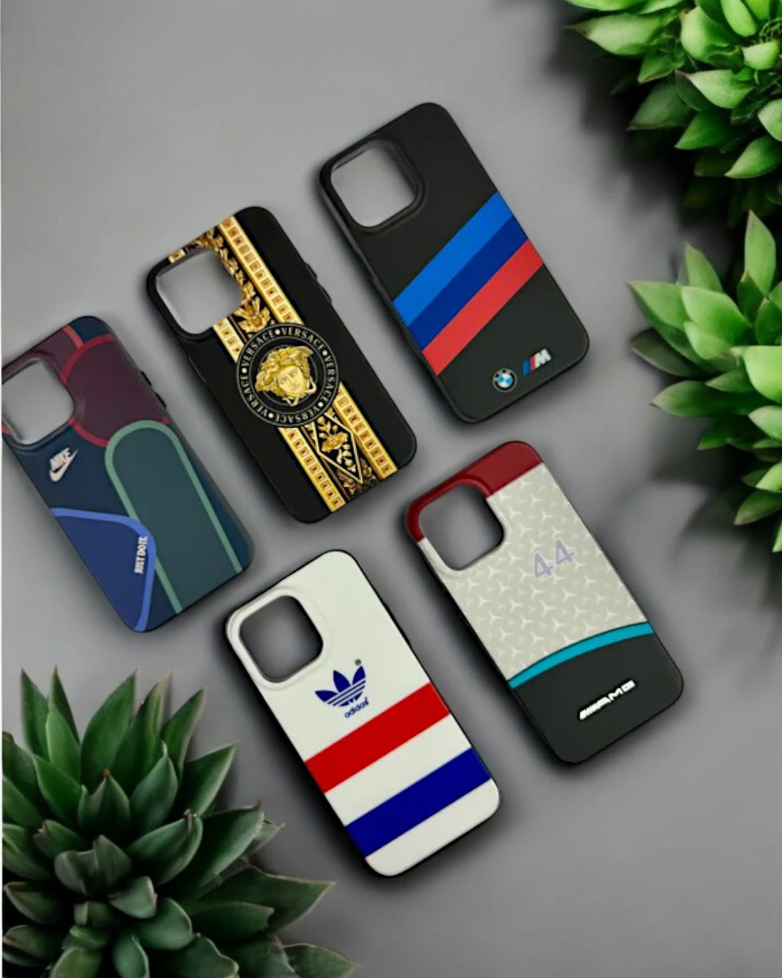  A collection of five stylish iPhone cases, iphone 15 pro max cover  featuring luxury and sports brand inspired designs, perfect for adding a premium touch to your device.