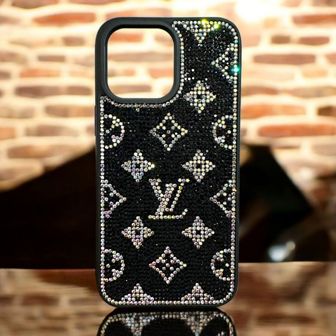 Elegant black iPhone cover for 14 pro max cover featuring dazzling rhinestone LV monogram design for a premium, stylish look.
