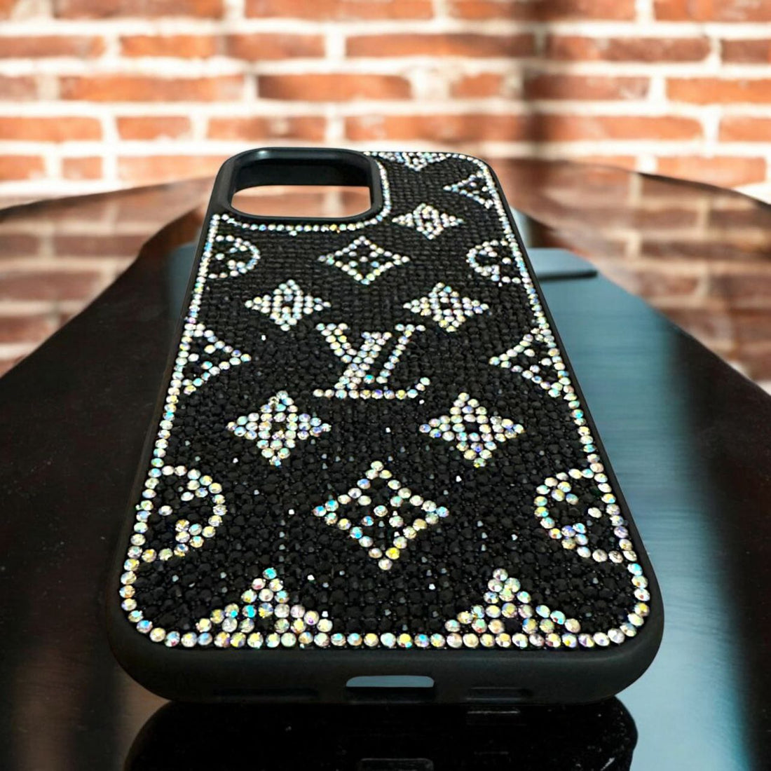  Stunning black mobile cover for 14 pro max cover with sparkling crystals forming the iconic LV inspired pattern.