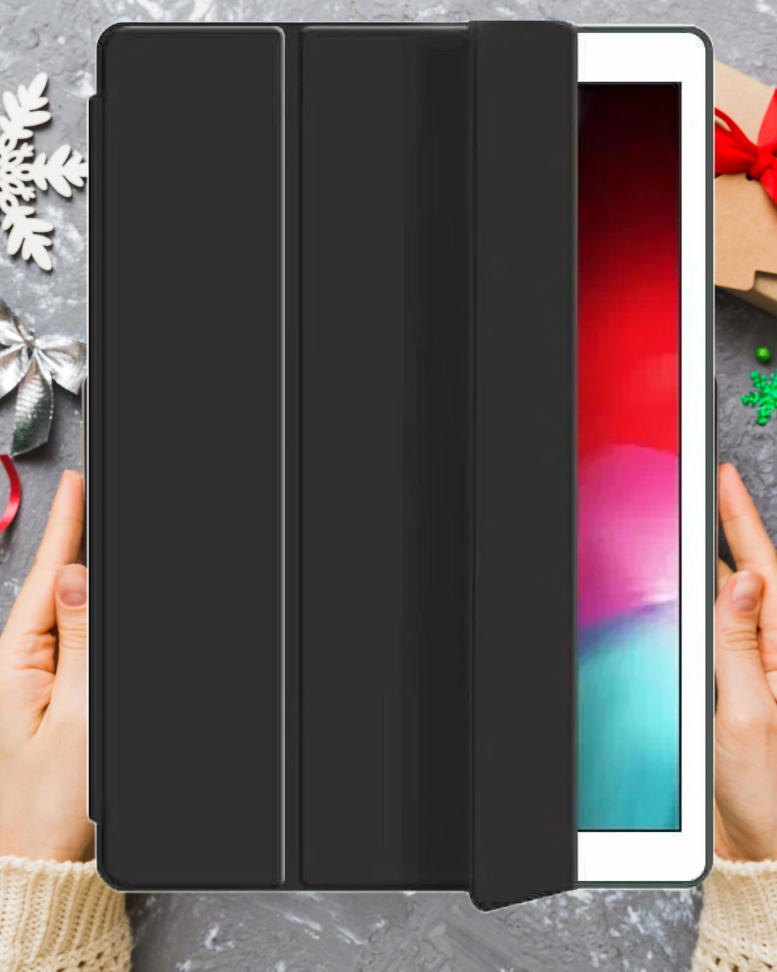 A sleek and protective black smart ipad cover with an integrated pencil holder. Magnetic tri fold design for auto sleep wake function