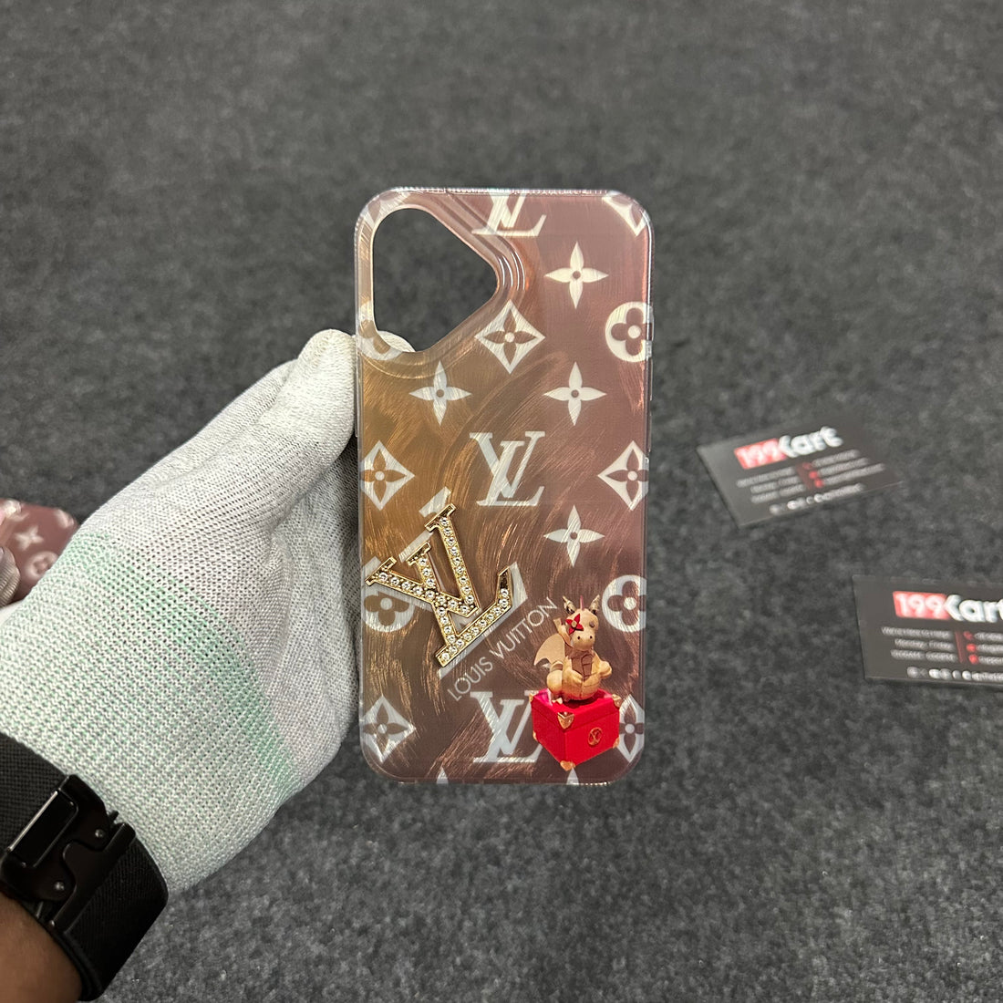 Elegant golden electroplated iPhone case with a glossy finish and an embossed golden LV stone logo for a luxurious look for iphone 16 cover