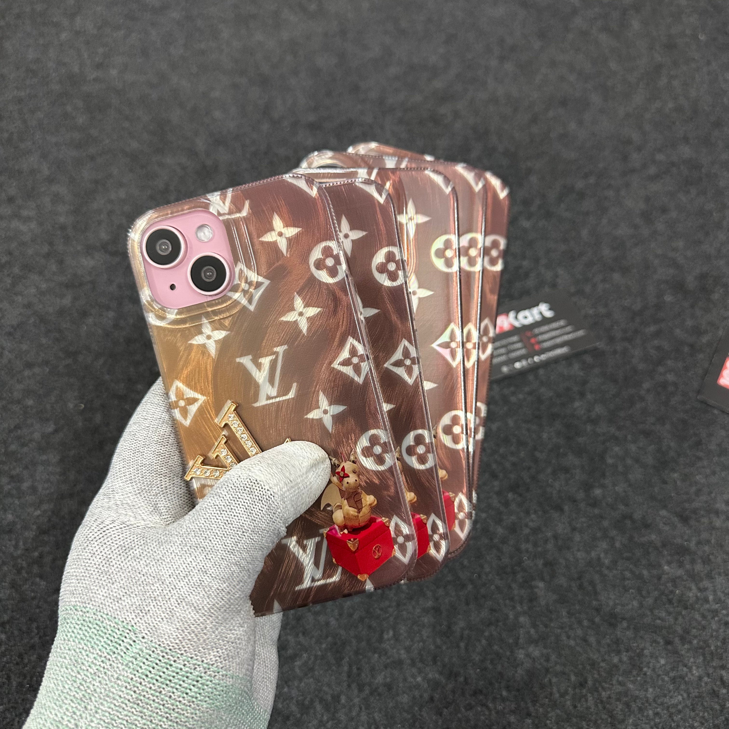 Eye catching iPhone case with metallic gold edges and center aligned LV logo in a raised stone texture for iphone 16 case