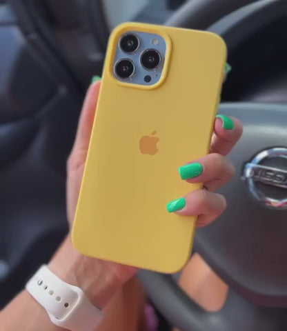 A person presents an array of yellow iPhone cases, iphone case emphasizing their cheerful color and trendy look.